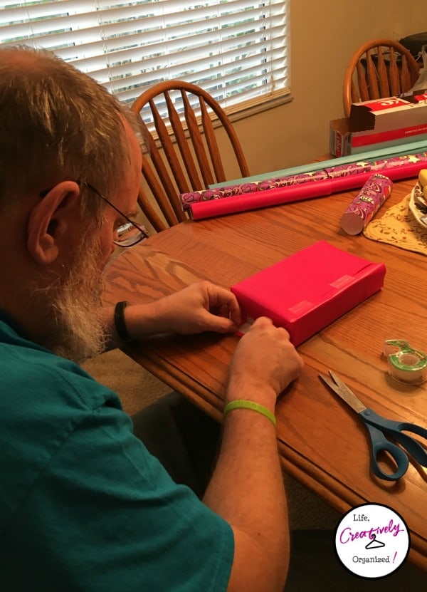 Jim wrapping boxes